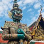 gold and blue dragon statue under blue sky during daytime