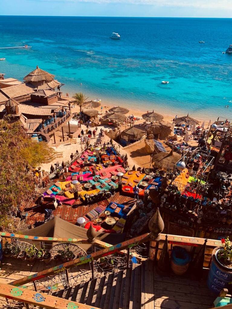 a bunch of umbrellas that are on a beach