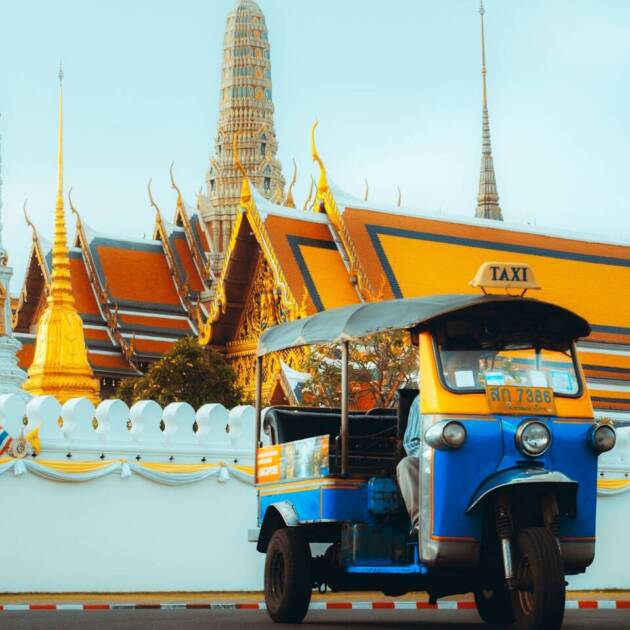 blue and yellow auto rickshaw on road during daytime